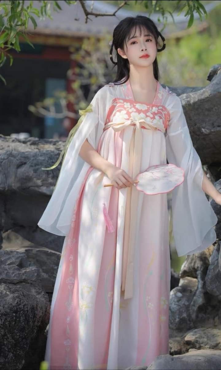 Apricot-Colored Innovations in Traditional Cheongsam Design Apricot-Colored Innovations in Traditional Cheongsam Design